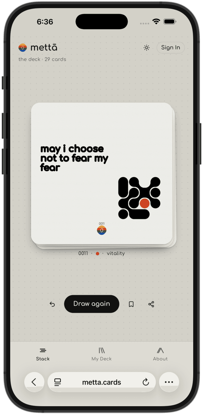 metta.cards on an iPhone, the drawn card reading "may i choose not to fear my fear"